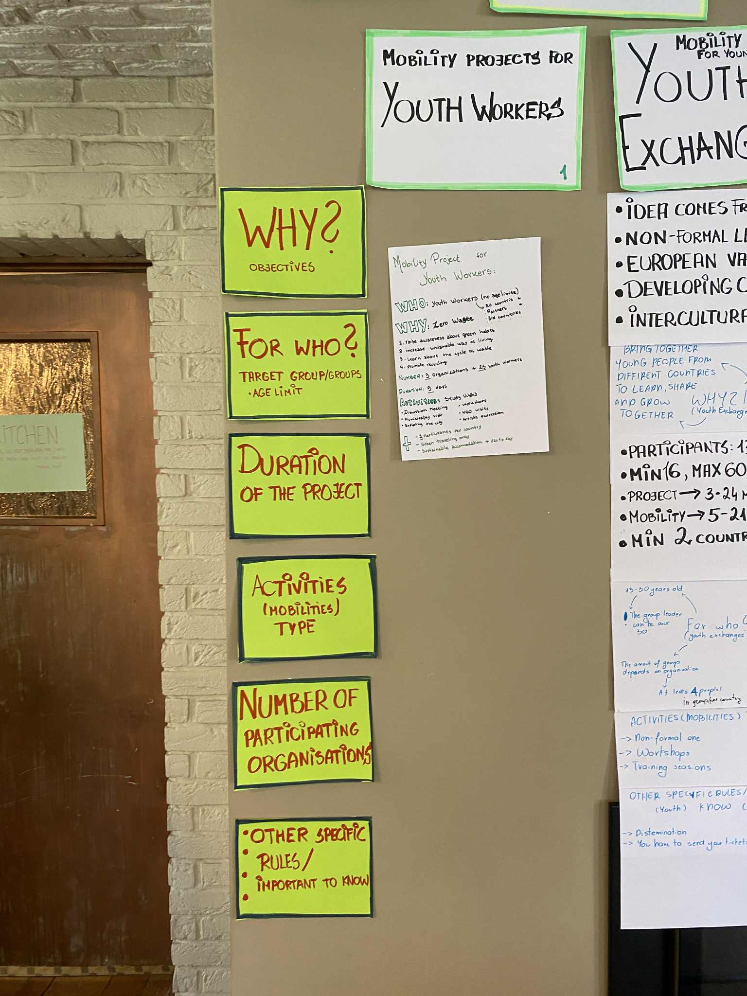 a person standing on a ledge overlooking a town