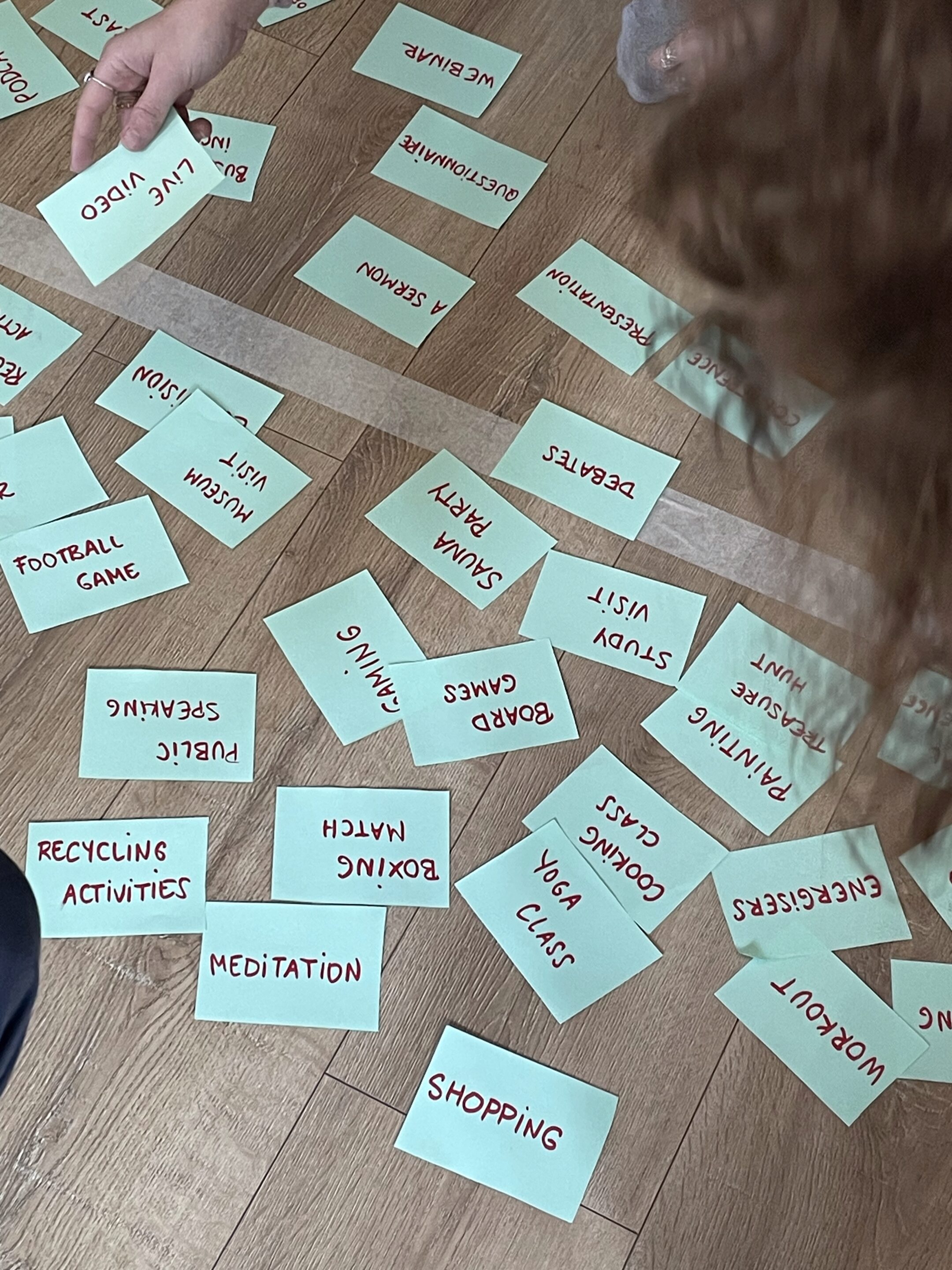 a person standing on a ledge overlooking a town