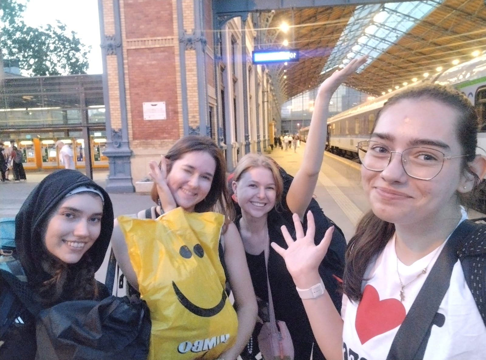 a person standing on a ledge overlooking a town