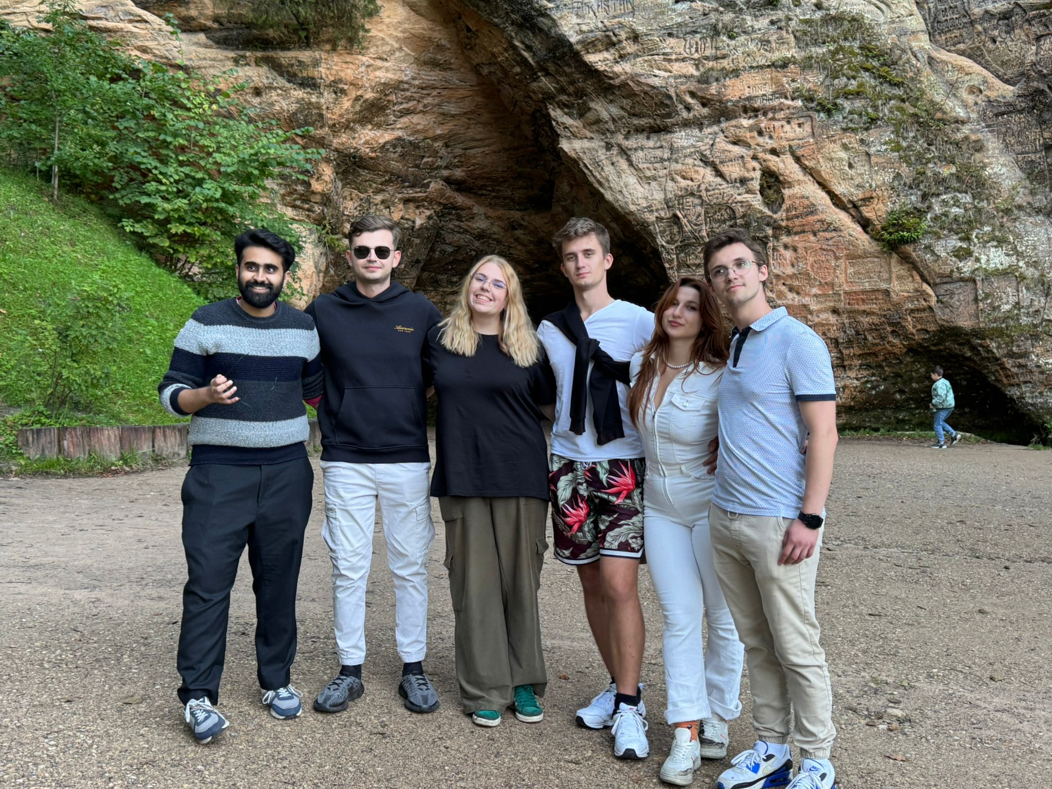 a person standing on a ledge overlooking a town